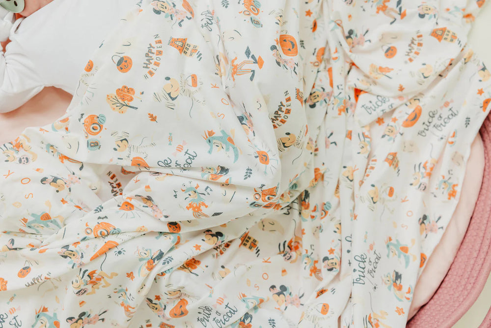 
                      
                        Copper Pearl Swaddle | Mickey Mouse's Boo Bash
                      
                    