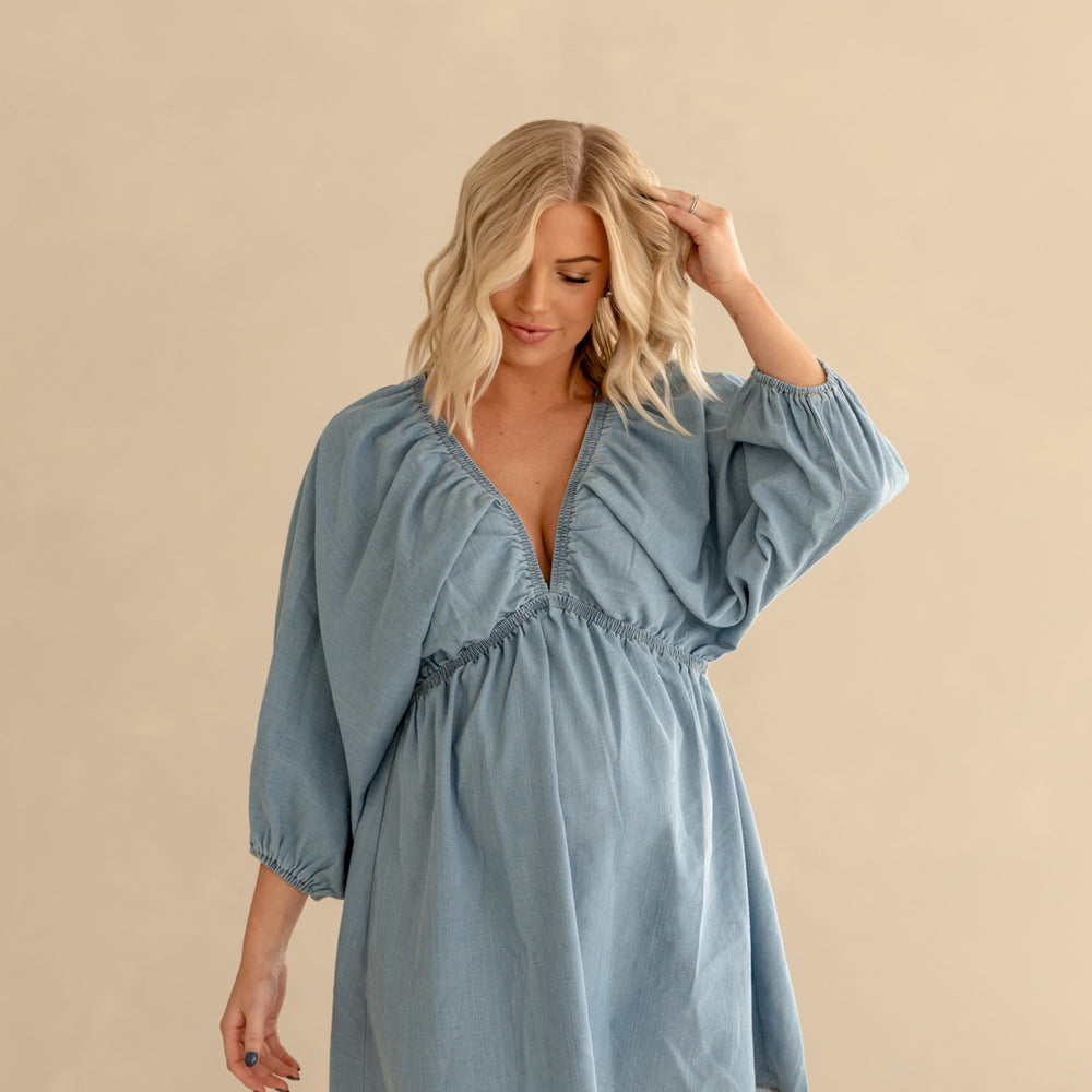 
                      
                        Journee Woven Mini Dress | Light Denim
                      
                    